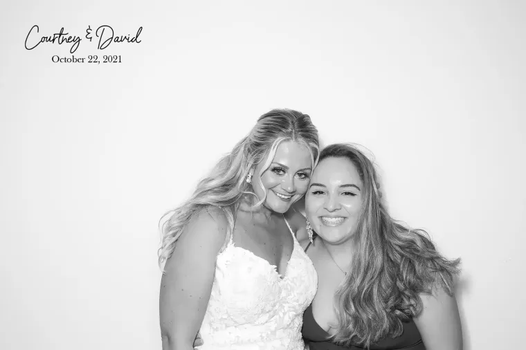 glam booth bride and friend black and white photo booth
