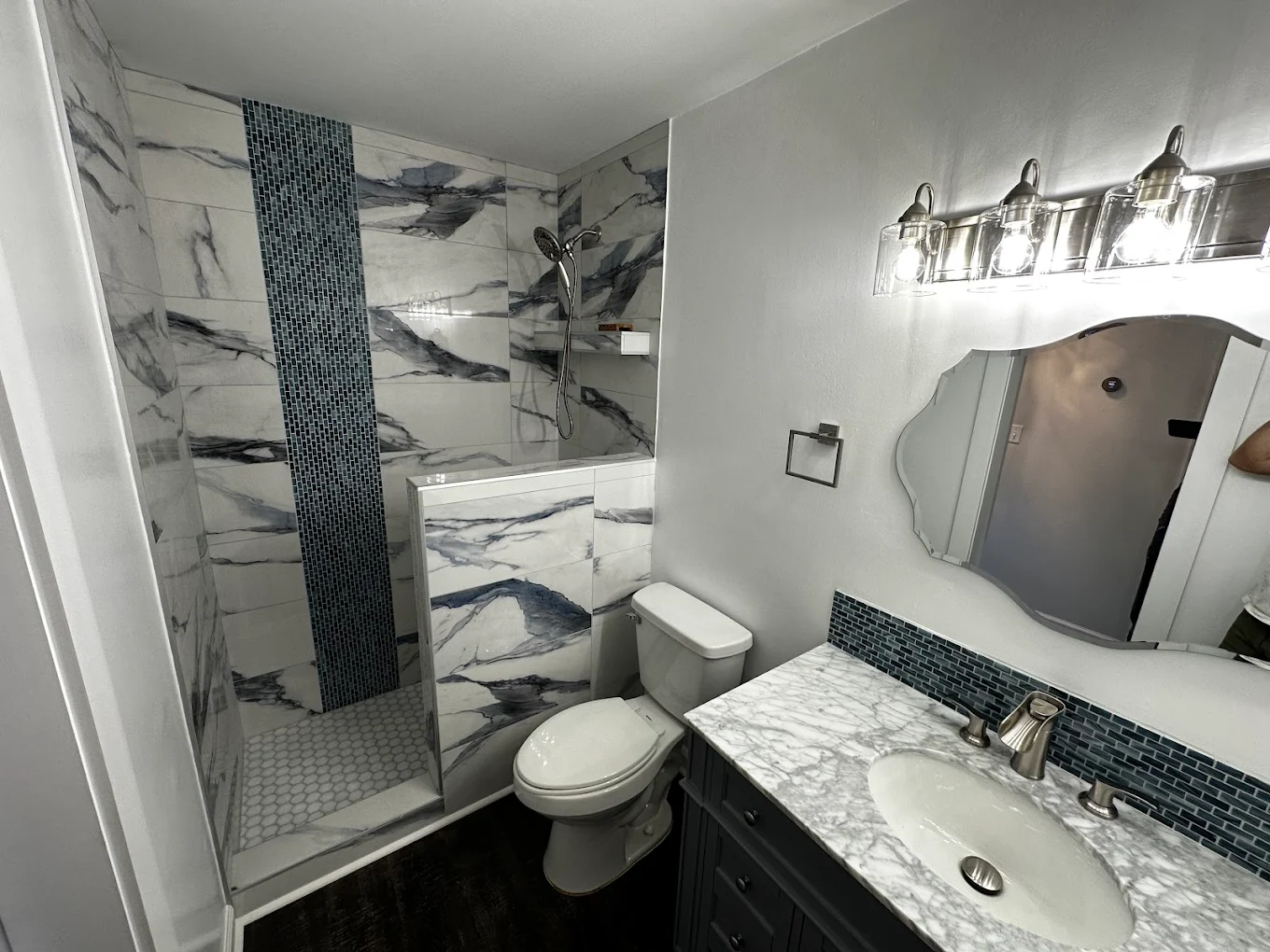 Bathroom Remodeling Project in Carolina Forest - This bathroom remodeling project in Carolina Forest included a full shower upgrade with modern tile, fixtures, and finishes. The result is a clean, contemporary bathroom that blends durability, water resistance, and visual appeal for long-term use.